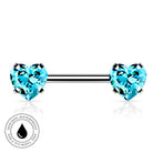 A silver-toned barbell piercing jewelry piece with two heart-shaped light blue gemstones, shown on a white background with a circular 'Skin Safe Waterproof' badge in the lower left.