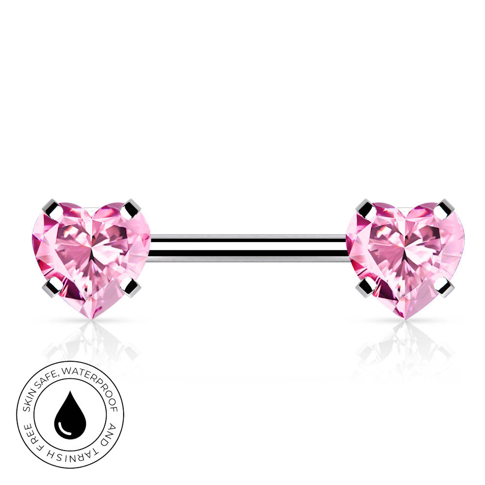 A silver-toned barbell piercing jewelry piece with two heart-shaped pink gemstones, shown on a white background with a circular 'Skin Safe Waterproof' badge in the lower-left corner.