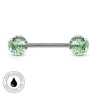 A silver-toned barbell piercing jewelry piece with two round clear resin ends filled with green and silver glitter, shown on a white background with a circular 'Skin Safe Waterproof' badge in the lower-left corner.