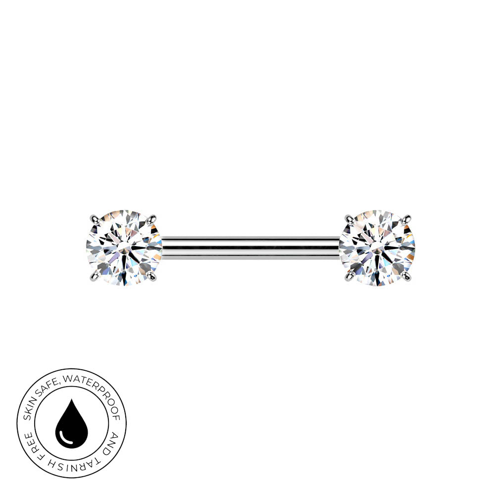 A silver-toned barbell piercing jewelry piece with two round-cut clear gemstones, shown on a plain white background with a circular 'skin-safe waterproof and tarushi free' badge in the lower-left corner.