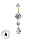Gold-plated curved navel barbell with three dangling clear cubic zirconia stones, shown on a white background with a circular skin-safe waterproof badge in the lower-left corner.