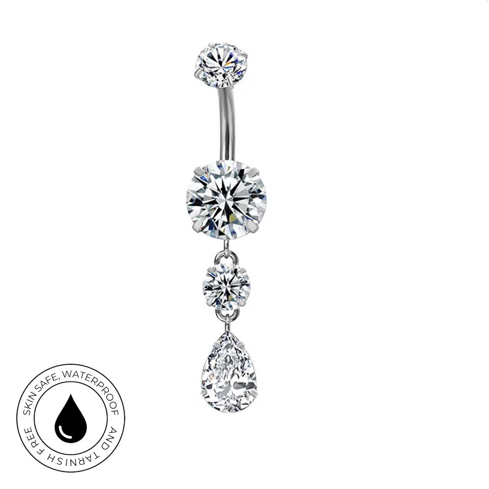 A silver-toned navel ring with three dangling clear gemstones, including a teardrop-shaped stone at the bottom. A circular 'Skin Safe Waterproof' badge is shown in the lower-left corner on a plain white background.