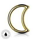 A polished gold crescent-shaped ring with a high-shine finish, displayed on a clean white background with a subtle reflection. A circular badge in the bottom-left corner highlights its skin-safe, waterproof, and tarnish-free qualities.