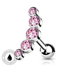 A silver-toned curved barbell piercing jewelry piece with five stacked round pink gemstones, shown on a white background with a small circular skin-safe water-pipe icon in the lower left.