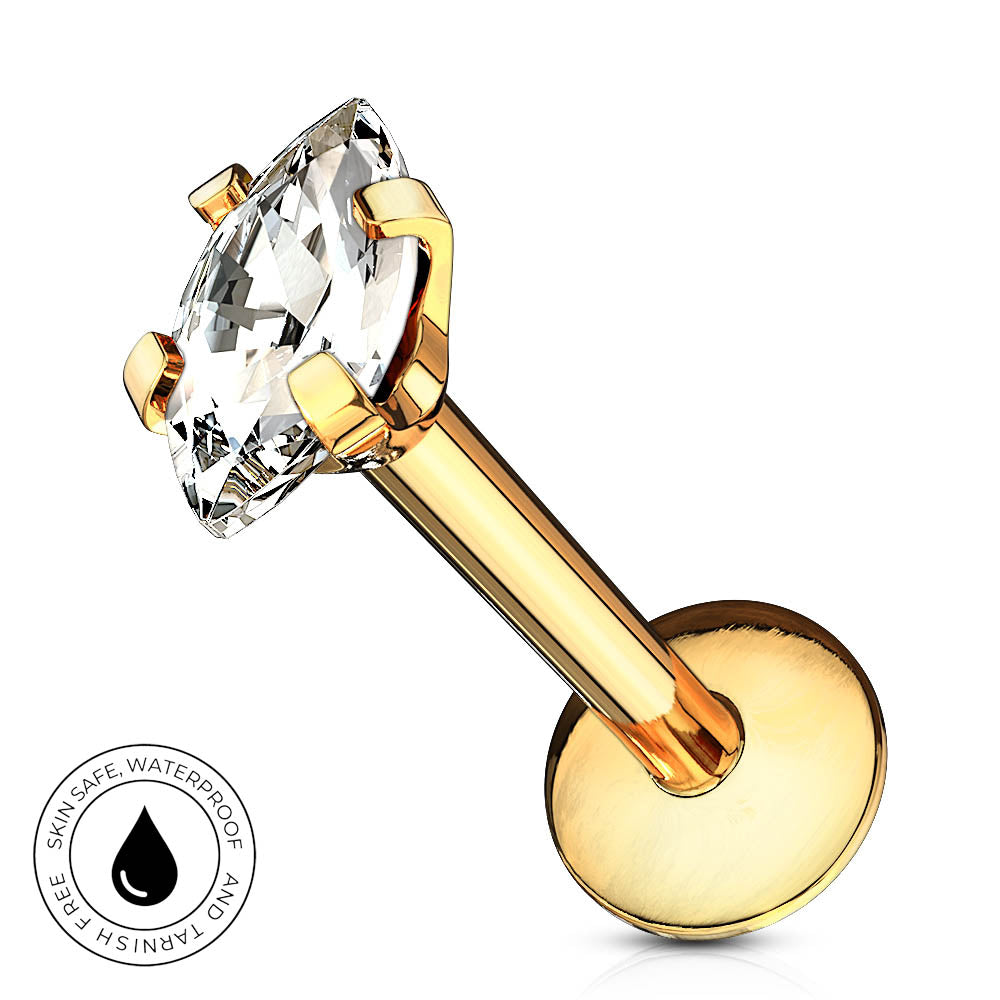 A gold-plated labret piercing stud with a marquise-cut clear gemstone, shown on a white background with a circular 'Skin Safe Waterproof' badge in the bottom-left corner.