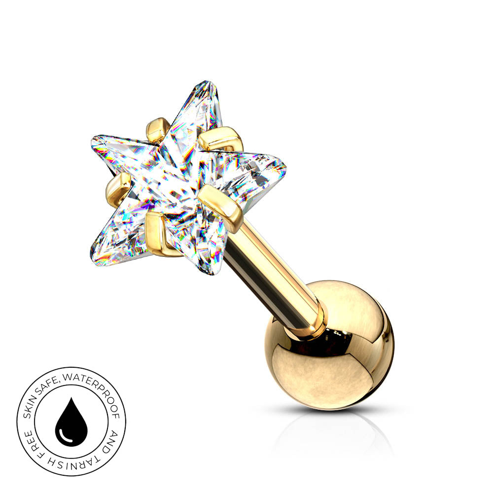 A gold-plated labret piercing stud with a five-pointed star-shaped clear crystal gemstone and a round gold ball back. A circular badge in the bottom-left corner highlights the skin-safe, waterproof material.