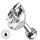 A teardrop-shaped clear faceted gemstone stud with a polished silver metal post and ball end, shown on a white background with a circular 'Skin Safe Waterproof' badge in the lower left.