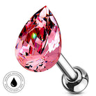 A pink faceted teardrop-shaped labret piercing stud with a polished silver metal post and ball, shown on a white background with a circular 'Skin Safe Waterproof' badge in the lower left.