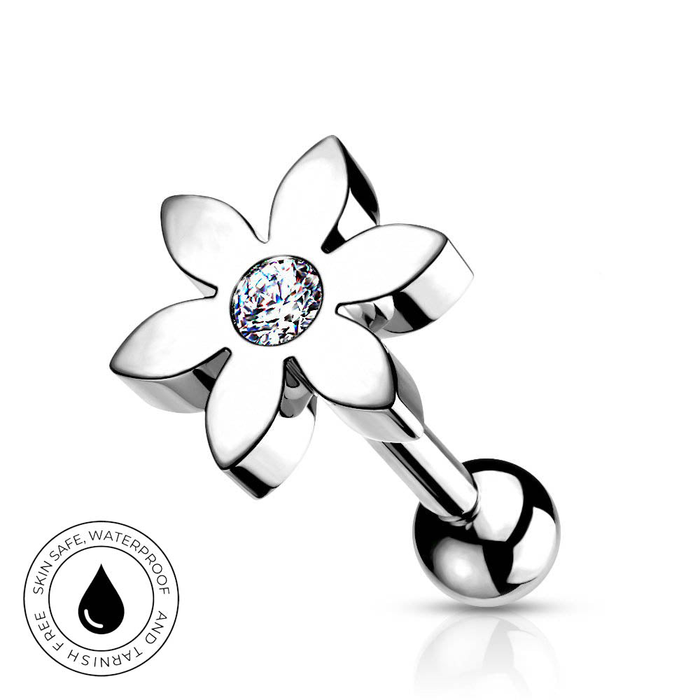 A silver-toned flower-shaped belly button ring with a clear faceted gemstone in the center and a ball end, shown on a white background with a small circular skin-safe waterproof badge.