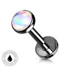 A stainless steel labret piercing barbell with a round, iridescent, skin-safe waterproof top. A circular badge in the bottom-left corner highlights the waterproof and skin-safe features.