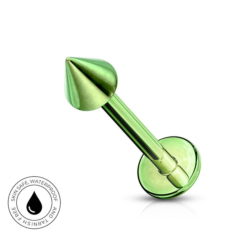A metallic green labret piercing barbell with a conical tip and a flat circular backing, shown on a clean white background with a small circular 'skin-safe waterproof' badge in the lower-left corner.