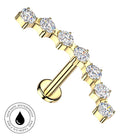 Gold barbell nipple stud with seven round-cut clear gemstones, shown on a white background with a circular 'Skin Safe Waterproof' badge in the lower-left corner.