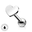 A silver stainless steel labret piercing barbell featuring a polished heart-shaped front and a spherical ball back, shown on a white background with a circular 'Skin Safe Waterproof' badge in the bottom-left corner.