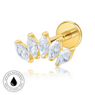 A gold-plated labret stud earring featuring four marquise-cut clear crystals in a row, shown on a white background with a reflection and a circular 'Skin Safe Waterproof' badge in the lower-left corner.