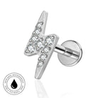 A silver lightning bolt stud earring with clear gemstones, shown on a white background with a circular 'Skin Safe Waterproof' badge in the lower-left corner.