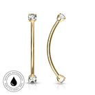 Two gold-plated curved barbell nose studs with clear gemstones, shown on a white background with a circular 'Skin Safe Waterproof' badge in the lower-left corner.
