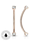 Rose gold curved barbell nose jewelry with clear gemstones on both ends, shown on a white background with a circular skin-safe waterproof badge in the lower left.