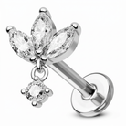 A silver-toned flat-back labret piercing stud featuring a dangling flower charm with marquise-cut clear crystals and a smaller round clear crystal, shown on a white background.