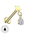 A gold-plated barbell stud piercing with a star-shaped top and a dangling round clear gemstone charm, shown on a plain white background with a small 'skin-safe waterproof' badge in the lower-left corner.