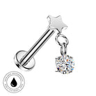 A silver-toned barbell-style body jewelry piercing with a star-shaped top and a dangling round clear gemstone charm, shown on a white background with a small 'skin-safe waterproof' badge in the lower left.