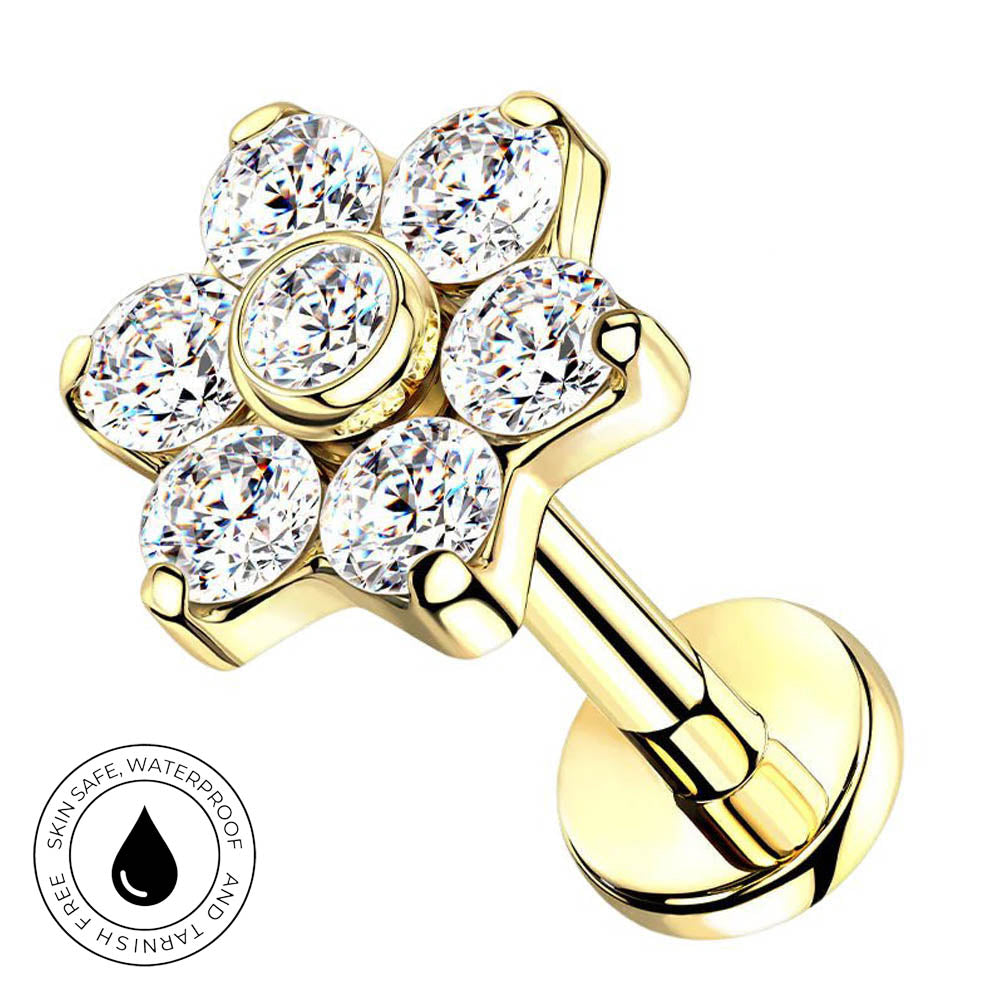 Gold flower-shaped cartilage piercing stud with six clear round-cut cubic zirconia stones, shown on a white background with a circular 'Skin Safe Waterproof' badge in the lower-left corner.