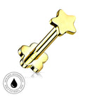 Gold-plated stainless steel barbell piercing stud with a star-shaped end and a flower-shaped end, shown on a white background with a circular 'Skin Safe Waterproof' badge in the bottom-left corner.