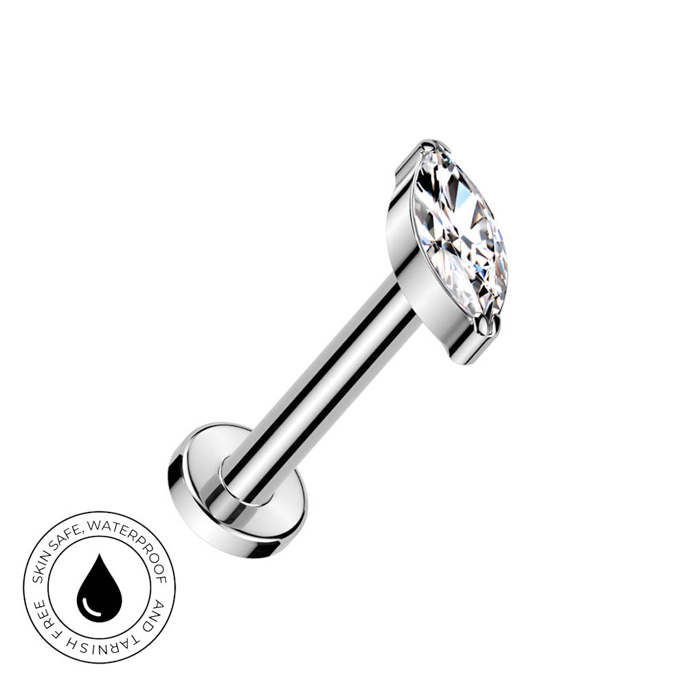 A silver-toned labret piercing barbell with a marquise-cut clear gemstone, shown on a plain white background with a circular 'Skin Safe Waterproof' badge in the bottom-left corner.