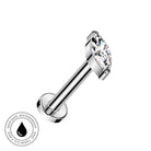A silver-toned labret piercing barbell with a marquise-cut clear gemstone, shown on a plain white background with a circular 'Skin Safe Waterproof' badge in the bottom-left corner.
