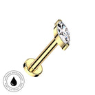 A gold-plated labret piercing barbell with a marquise-cut clear gemstone, shown on a plain white background with a circular 'Skin Safe Waterproof' badge in the bottom-left corner.