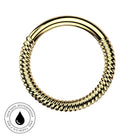 A gold-colored silicone adult novelty ring with a twisted rope texture on the lower half and a smooth curved top band, shown on a white background with a circular 'Waterproof and Tarnish Free' badge in the bottom-left corner.