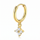 A gold hoop earring with a dangling flower charm set with clear gemstones, shown on a clean white background with a subtle reflection.