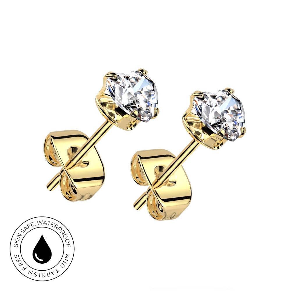 A pair of gold stud earrings with clear round-cut gemstones, shown on a plain white background. One earring is angled to show the front stone and the other shows the side profile with the post and backing.