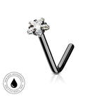 A black metal curved barbell-style body jewelry piece with a clear faceted gemstone at the top, shown on a white background with a small circular skin-safe waterproof badge in the lower left corner.