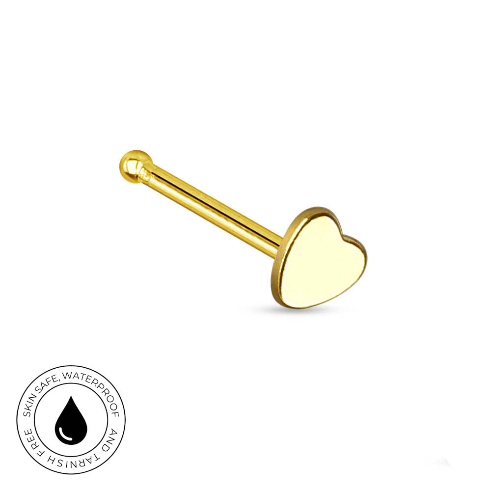 A gold-colored labret stud earring with a heart-shaped face, shown on a plain white background with a circular 'Skin Safe Waterproof' certification badge in the bottom-left corner.