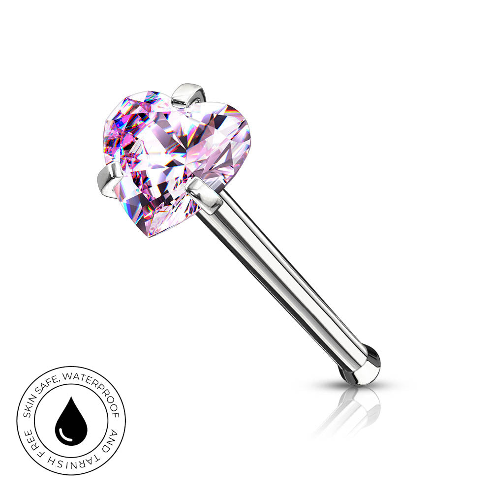 A silver-toned labret piercing barbell featuring a faceted, heart-shaped pink gemstone, shown on a clean white background with a small circular 'SkinSafe Waterproof' badge in the lower-left corner.