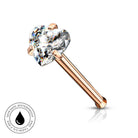 A rose gold nose ring with a heart-shaped clear gemstone, shown on a white background with a small circular 'Skin Safe Waterproof' badge in the bottom-left corner.