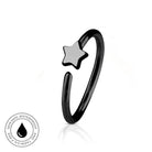 A black metal open-ended ring with a small five-pointed star charm, shown on a white background with a reflection and a circular skin-safe waterproof badge.