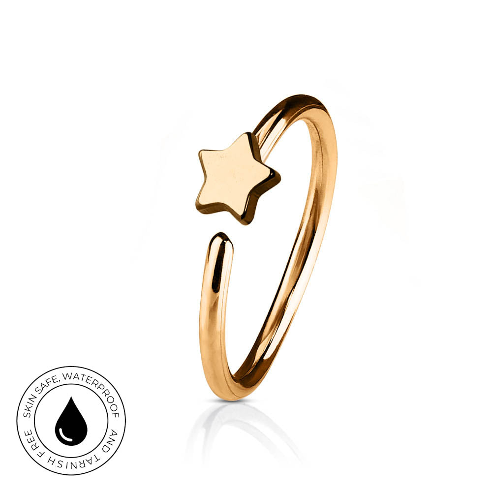 A gold-plated open bangle ring with a small star charm, shown on a white background with a reflection and a circular 'Skin Safe Waterproof' badge in the bottom-left corner.