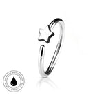 A silver-toned open ring band featuring a small star-shaped charm, shown on a clean white background with a subtle reflection. A circular 'Skin Safe Waterproof' badge is visible in the bottom-left corner.