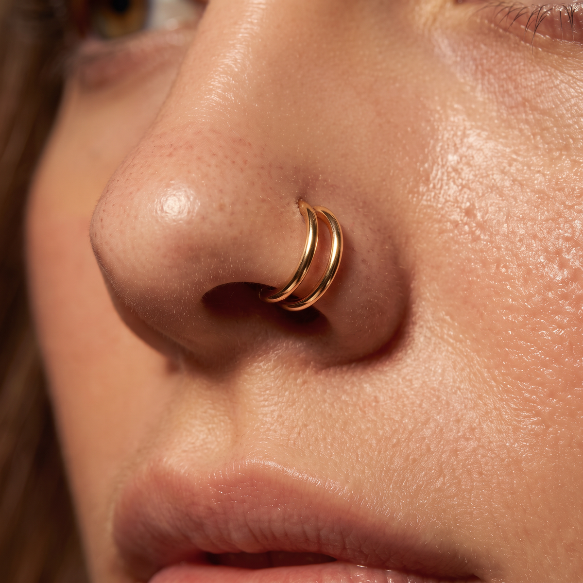 20 Gauge Titanium Double Hoop Hinged Segment Ring gold worn by model