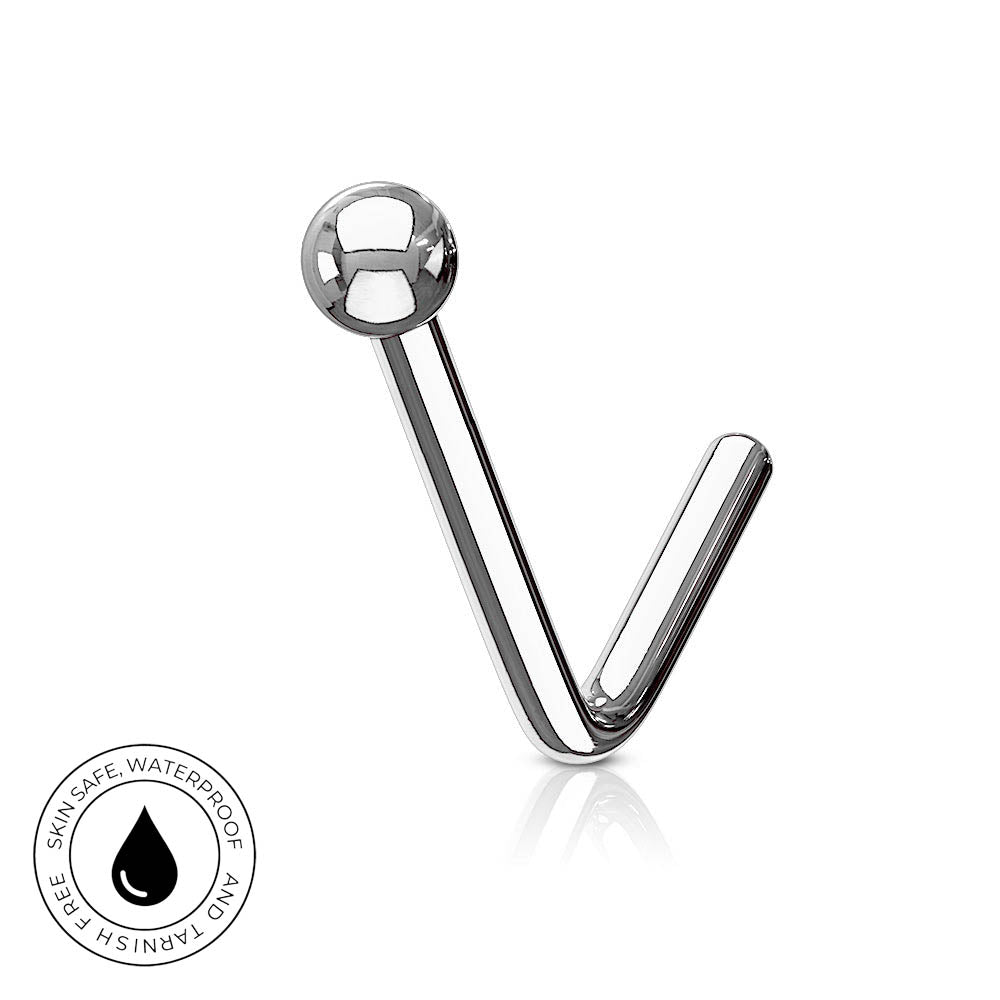 A curved stainless steel labret piercing stud with a polished ball top, shown on a white background with a small circular skin-safe waterproof badge in the lower-left corner.