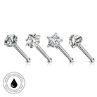 Four silver-toned nose studs with clear gemstones in star and cluster settings, displayed on a white background with a circular 'Skin Safe Waterproof' badge in the lower left.