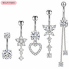 A set of five silver-toned belly button ring piercings with clear rhinestones, shown on a white background with a pink 'MULTI PACK' label in the top left. Designs include a large round stone, a flower, a heart outline, a butterfly, and a dangling chain.