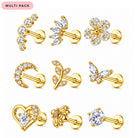 A set of nine gold-colored stud earrings with clear rhinestones in various designs, including flowers, moons, leaves, butterflies, hearts, and bees, arranged on a white background with a pink 'MULTI PACK' label in the top left corner.