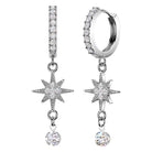 A pair of silver-toned dangle earrings with pavé-set clear stones, featuring a huggie hoop, a vertical bar, an eight-pointed star, and a dangling round crystal charm, shown on a plain white background.