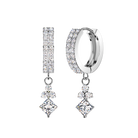 A pair of silver huggie hoop earrings with pavé-set clear stones, featuring a vertical bar drop and a diamond-shaped drop on a plain white background.