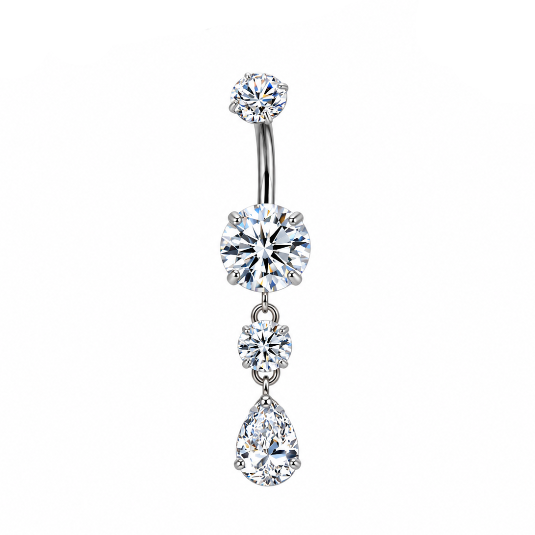 A silver-tone belly button ring with three dangling clear gemstones, shown on a white background with a brand logo in the top left and a close-up inset of the post in the top right.