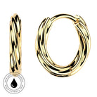 A pair of gold huggie hoop earrings with a twisted rope design, shown from both front and side angles on a white background. A circular badge on the bottom left indicates skin-safe, waterproof, and tarnish-free.