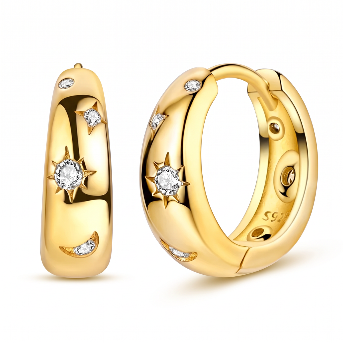 A pair of gold huggie hoop earrings with star and crescent moon motifs, accented with small clear gemstones, shown on a clean white background.