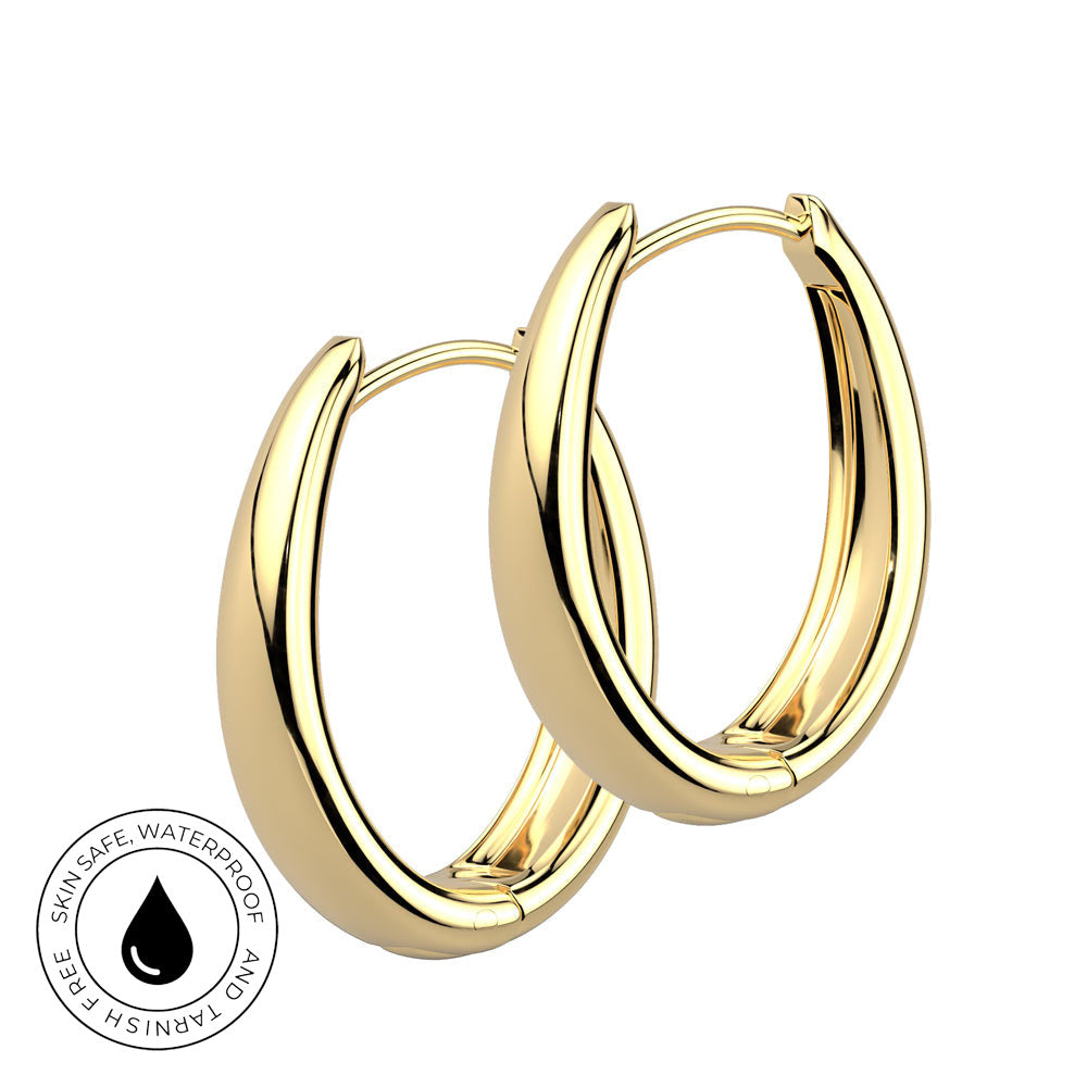 A pair of polished gold hoop earrings on a plain white background, with a small circular badge in the lower left that reads 'SKIN SAFE WATERPROOF' and 'TARNISH FREE' with a water droplet icon.